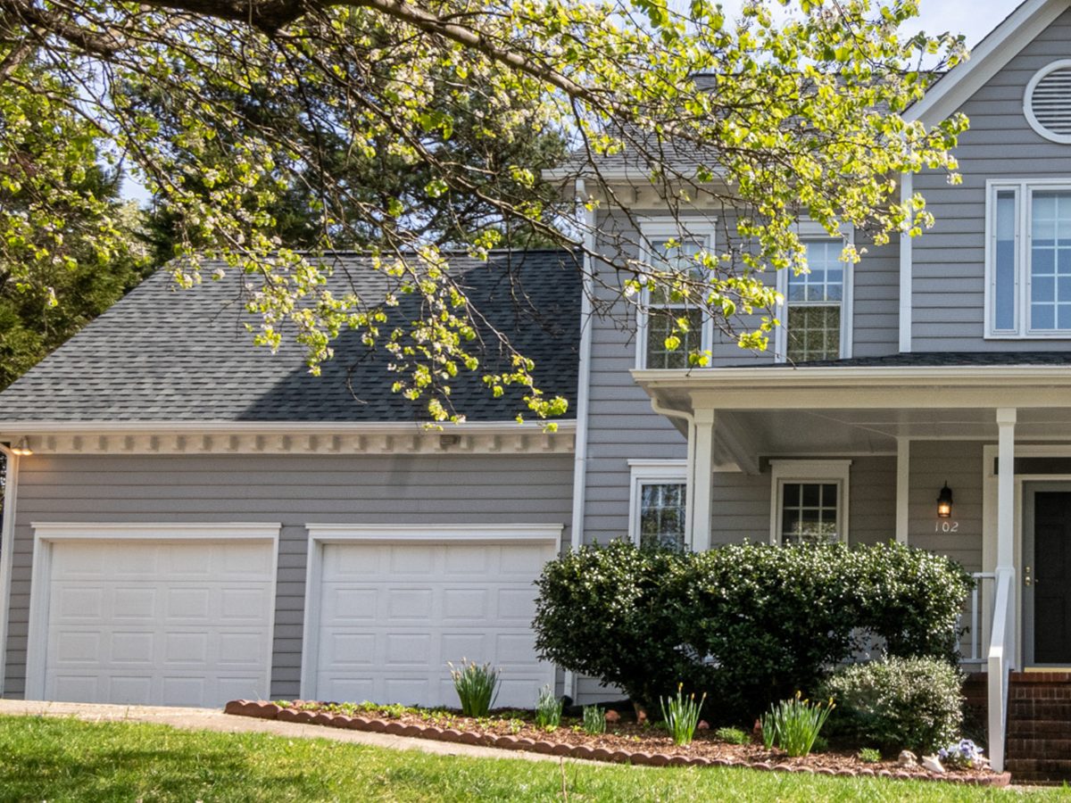 Attached double garage and landscaping